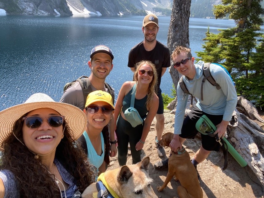 Photo of 6 Cardiology Fellows hiking near forest and water.