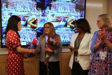Senator Claudia Kauffman receives a gift at the CIH Open House event.